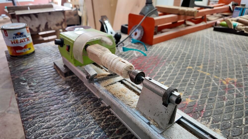 A wood lathe in the carpentry workshop.