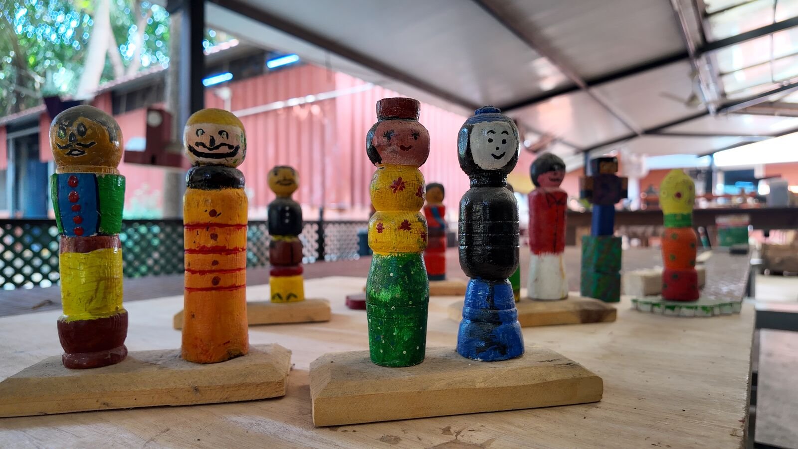 Wooden figures turned on a lathe and painted by students.