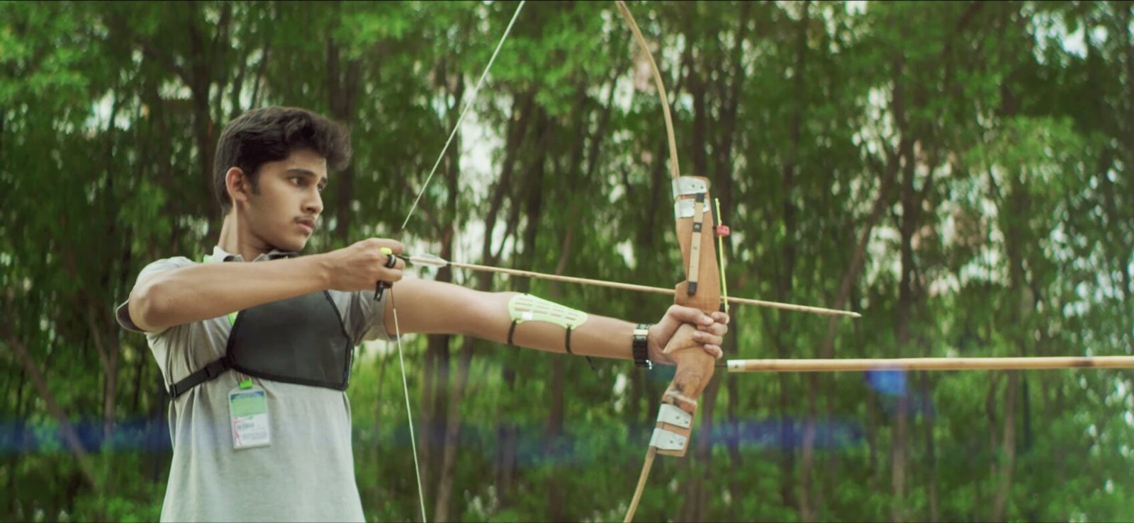 A student practising archery during evening sports.
