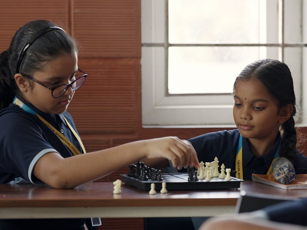 Two students playing chess.