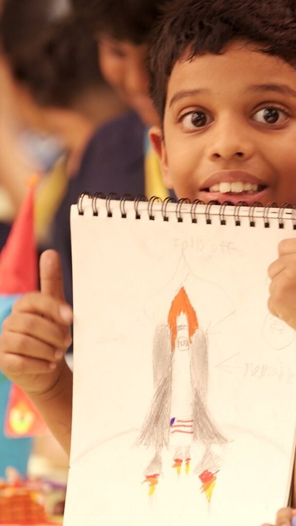 A student holding a sketchbook.