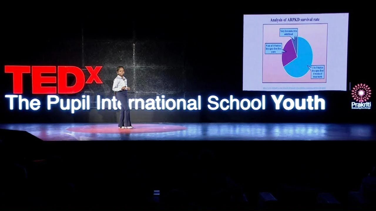 Vanshika Venkatesan giving her talk on the TEDx The Pupil International School Youth stage.