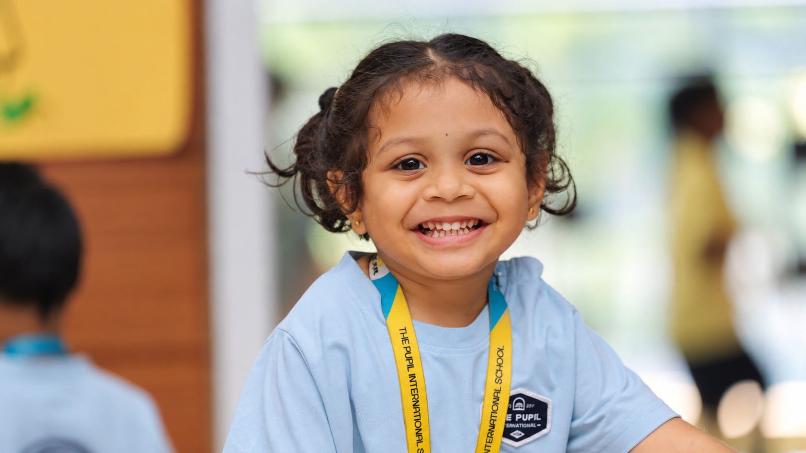 Smiling early years student at The Pupil International School in a classroom